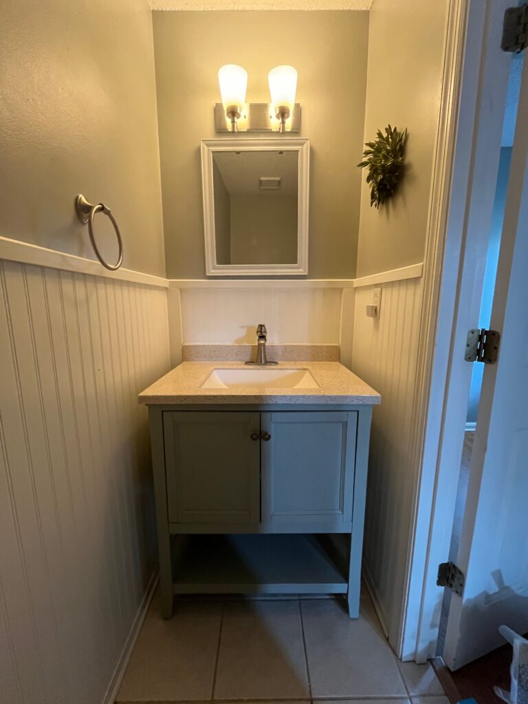 half bath makeover before picture of vanity