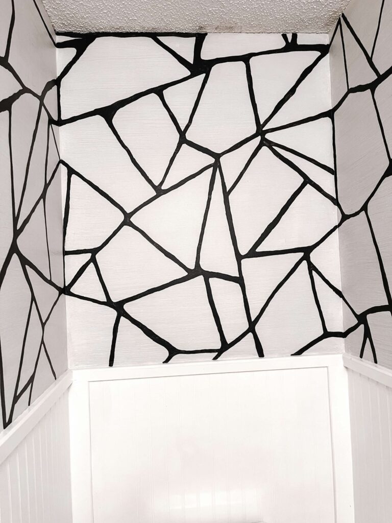 finished half bath painted grasscloth design