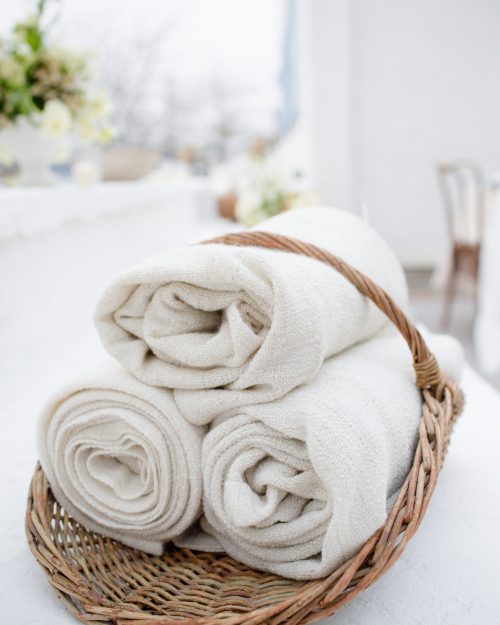 rolled-fabric-in-a-wicker-basket